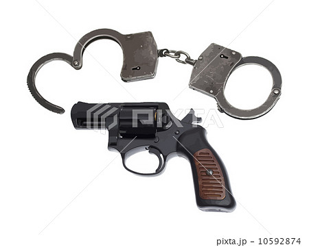 Handgun with handcuffs and bullets isolated on white. Vector ill 10592874