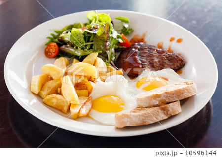 steak with eggs and vegetables 10596144