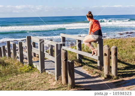 Girl Sitting Stairs Beach Ocean  10598323