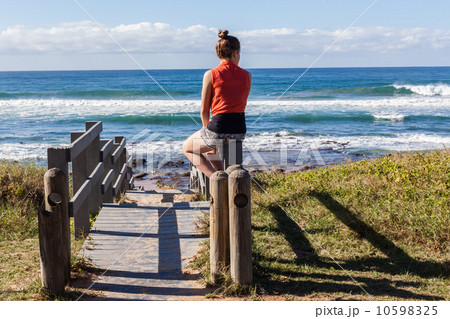 Girl Stairs Sitting Beach Ocean  10598325