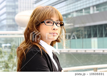young business woman and an office background 10606691