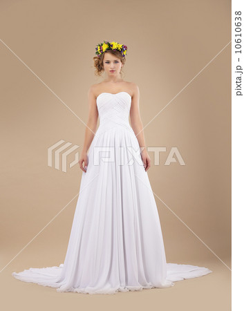 Espousal. Bride Fashion Model with Wreath of Flowers in White Dress Espousal. Bride Fashion Model with Wreath of Flowers in White Dress 10610638