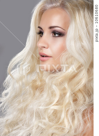 Groomed Woman's Face. Ash-colored Curly Hair Groomed Woman's Face. Ash-colored Curly Hair 10610680
