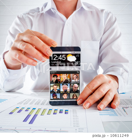 Smartphone with transparent screen in human hands. Smartphone with transparent screen in human hands. 10611249