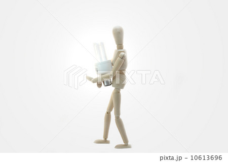 Wooden Manikin Doll Holding Low Energy Bulb 10613696