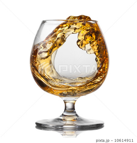 Splash of cognac in glass isolated Splash of cognac in glass isolated 10614911