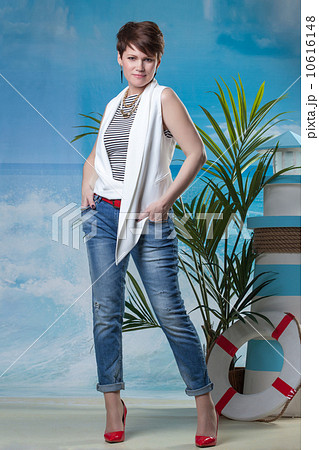 Stylish middle aged model posing in studio Stylish middle aged model posing in studio 10616148
