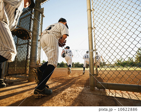 Baseball players (10-11) entering baseball diamond Baseball players (10-11) entering baseball diamond 10622886