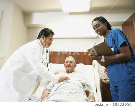 Senior patient with doctor and nurse 10622950