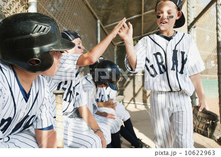 USA, California, Ladera Ranch, Boys (10-11) from little league sitting on dugout USA, California, Ladera Ranch, Boys (10-11) from little league sitting on dugout 10622963