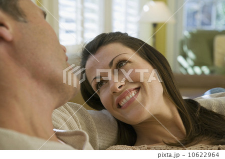 Couple relaxing in livingroom Couple relaxing in livingroom 10622964