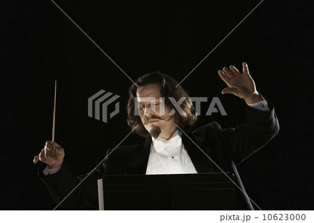 Man conducting behind music stand Man conducting behind music stand 10623000