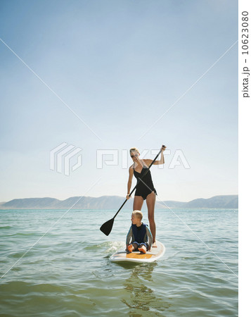 Young woman with daughter (4-5) on paddleboard Young woman with daughter (4-5) on paddleboard 10623080