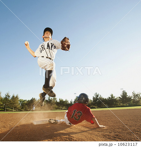 Boys (10-11) playing baseball 10623117