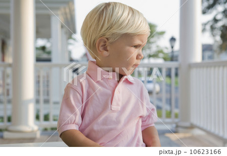 Boy sitting on porch Boy sitting on porch 10623166