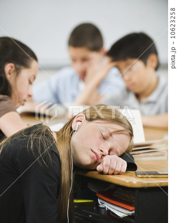 Student sleeping at her desk 10623258