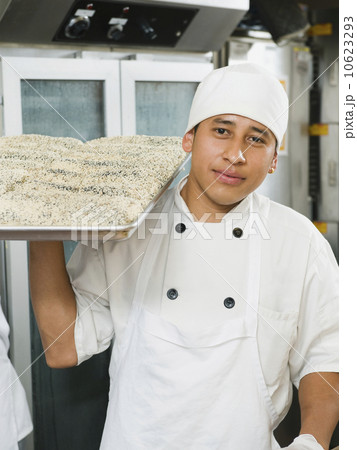 Chef holding tray of bread 10623293