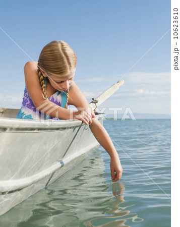 Girl (8-9) playing on boat 10623610