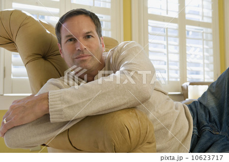 Man relaxing in arm chair 10623717