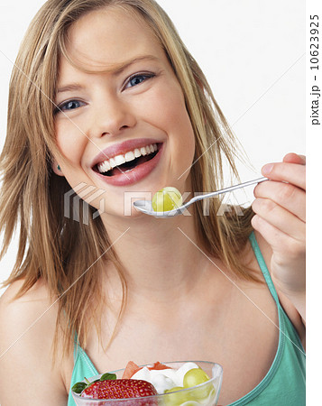 Woman eating fruit salad Woman eating fruit salad 10623925