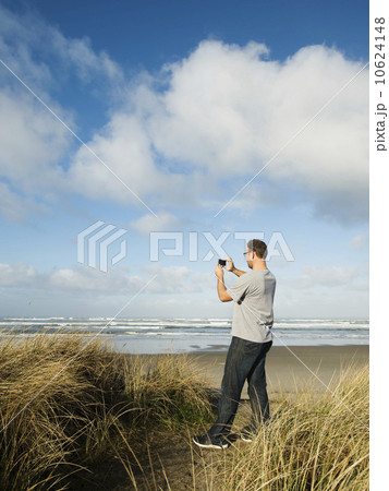 Mid adult man taking photograph 10624148