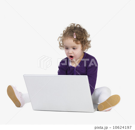 Preschool girl playing with laptop 10624197