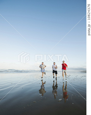 Men running on beach Men running on beach 10624376