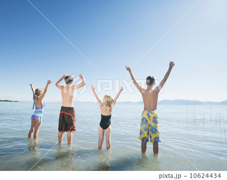 Kids (6-7,8-9,10-11,12-13) playing in lake Kids (6-7,8-9,10-11,12-13) playing in lake 10624434
