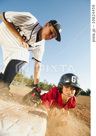 Boys (10-11) playing baseball Boys (10-11) playing baseball 10624456