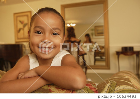 Boy in bedroom with family in background Boy in bedroom with family in background 10624493