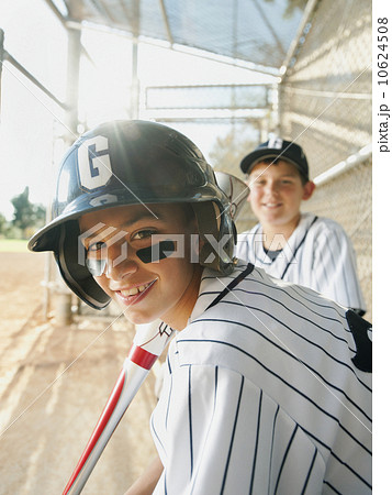 USA, California, Ladera Ranch, boys (10-11) from  little league baseball team on dugout 10624508