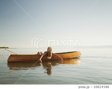 Young woman relaxing in canoe 10624586