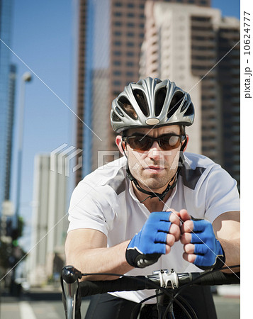 USA, California, Los Angeles, Portrait of young man road cycling on city street USA, California, Los Angeles, Portrait of young man road cycling on city street 10624777