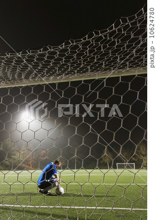 USA, California, Ladera Ranch, goalie on illuminated soccer field at night USA, California, Ladera Ranch, goalie on illuminated soccer field at night 10624780