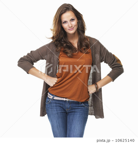 Studio shot of young woman with arms akimbo Studio shot of young woman with arms akimbo 10625140