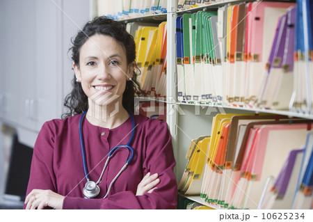 Female doctor next to charts 10625234