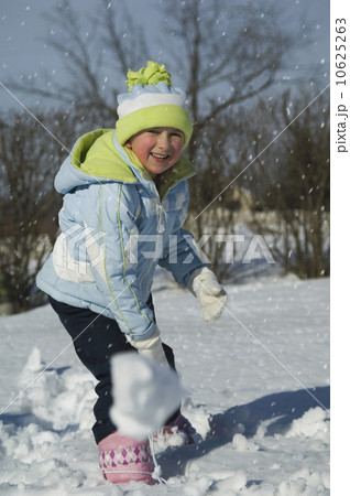 Girl throwing snowball Girl throwing snowball 10625263