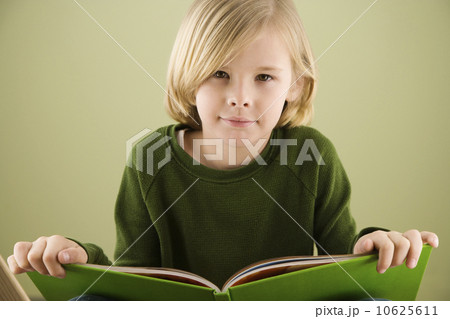 Boy holding book Boy holding book 10625611