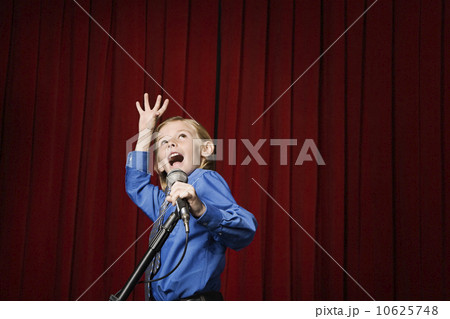 Boy singing on stage 10625748