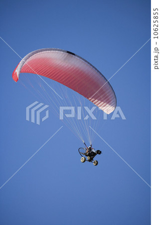 Low angle view of paraglider in air Low angle view of paraglider in air 10625855