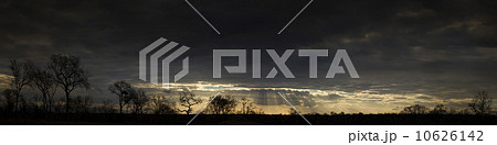 Sunbeams shining from clouds over African landscape 10626142