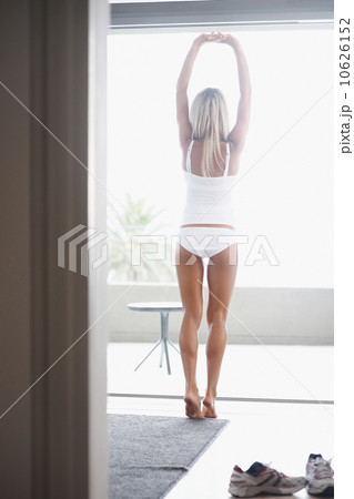 Woman wearing underwear and stretching 10626152