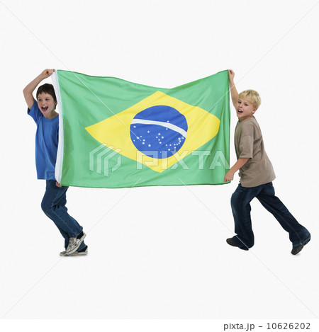 Two boys carrying flag Two boys carrying flag 10626202
