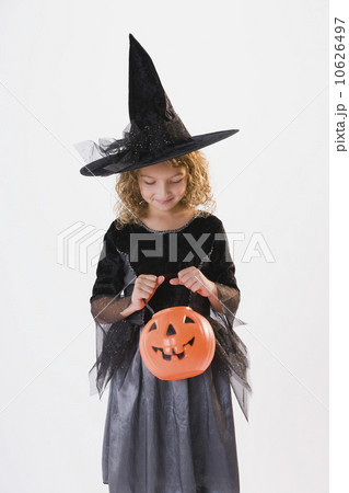 Girl dressed in witch Halloween costume 10626497