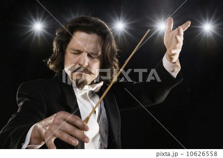 Man conducting under lights 10626558