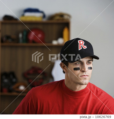 Baseball player looking pensive in locker room 10626769