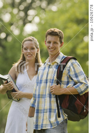 Portrait of college students with books and backpack 10626778