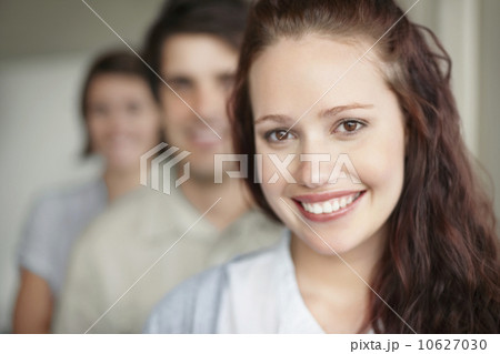 Three people standing in a row Three people standing in a row 10627030
