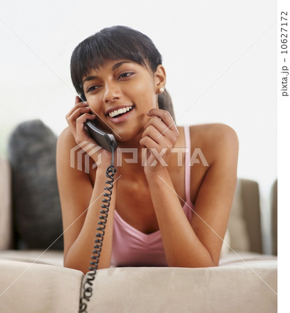 Young woman talking on phone Young woman talking on phone 10627172