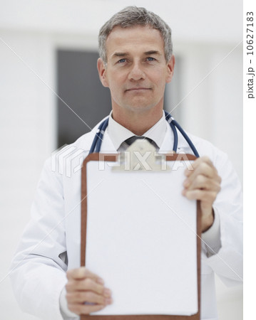 Doctor holding clipboard Doctor holding clipboard 10627183